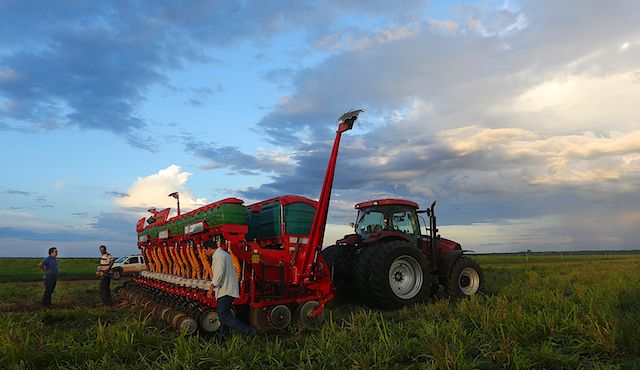 Tractor preparing soy bean field in the cerrado